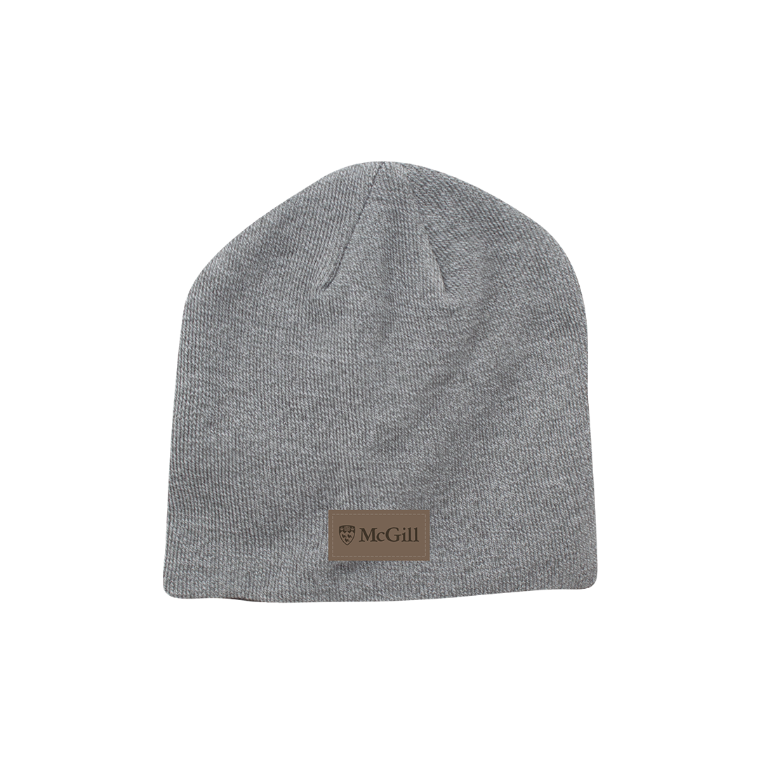 UNISEX - Get outside in style and warmth in this fitted knit tuque. Lightweight and soft, it features a faux suede open edged patch with the McGill logo.