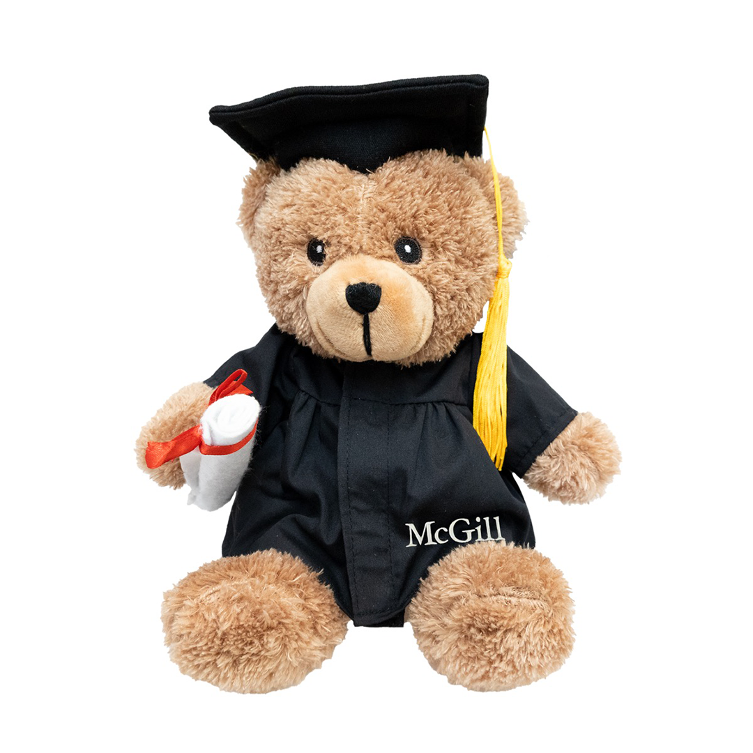 9" Grad Bear carrying a detachable diploma and dressed in a cap and gown featuring a golden tassel and “McGill” imprinted on the robe.