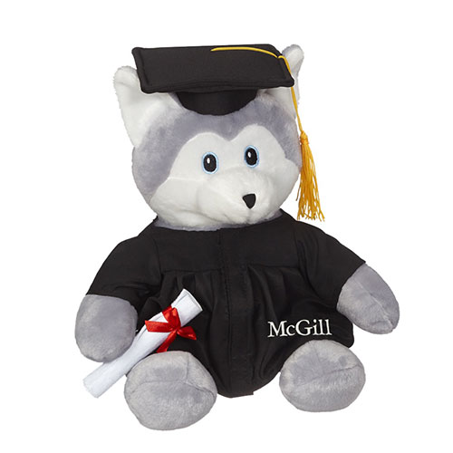 A 12" Husky Grad Plush carrying a diploma and wearing a grad cap and embroidered McGill gown.