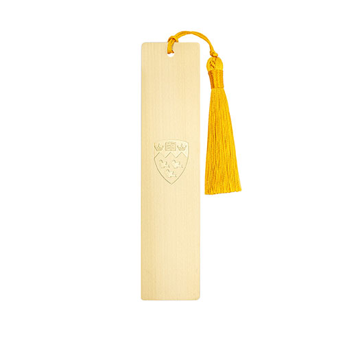 An elegant brushed gold bookmark etched with the iconic McGill crest and gold tassel.