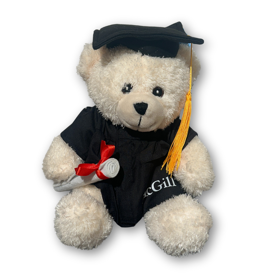 9" Grad Bear carrying a detachable diploma and dressed in a cap and gown featuring a golden tassel and “McGill” imprinted on the robe.
