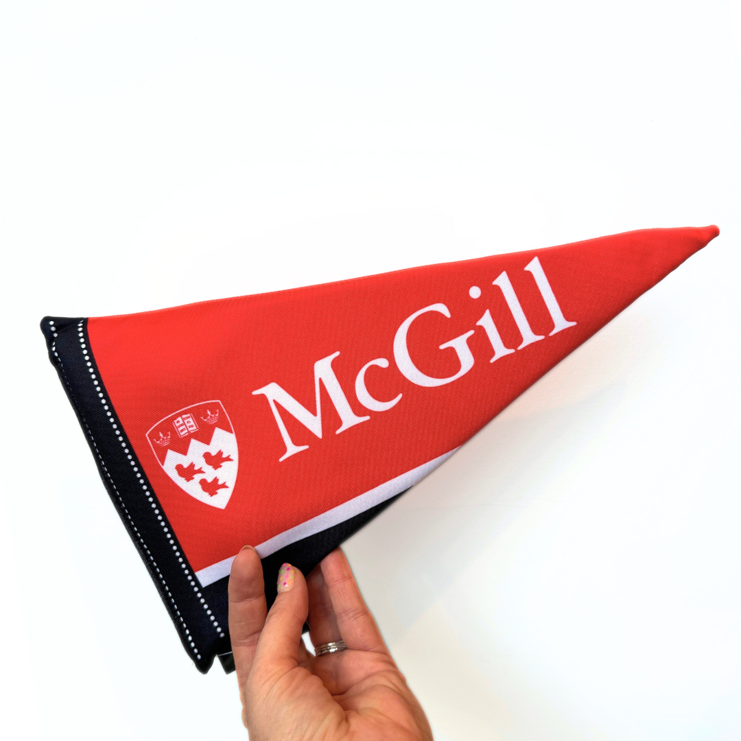 We know that all good boys cheer for McGill! This McGill pennant dog toy features a foam insert and not one but two squeakers to keep your pup busy while you are at class