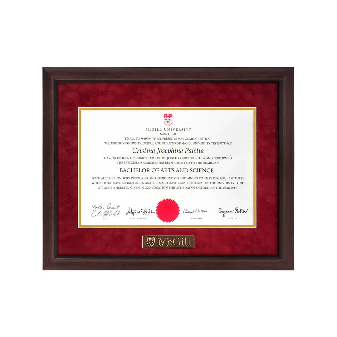 This frame features a gold plaque engraved with the McGill logo inset in the bottom border of the mat. Its profile has a subtle concave contour and is finished in a distinctive light walnut shade, highlighted with black filaments. It features a black lip on the inside edge of the moulding. Assembled with a double, acid-free red suede mat