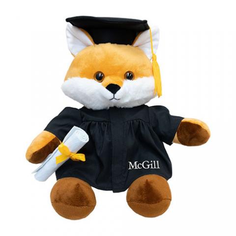 A 12" Fox Grad Plush carrying a diploma and wearing a grad cap and embroidered McGill gown.