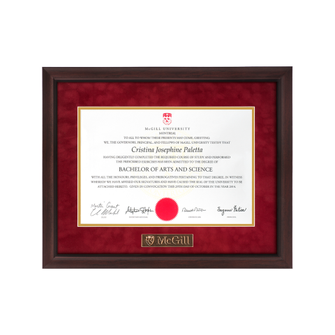 This frame features a gold plaque engraved with the McGill logo inset in the bottom border of the mat. Its profile has a subtle concave contour and is finished in a distinctive light walnut shade, highlighted with black filaments. It features a black lip on the inside edge of the moulding. Assembled with a double, acid-free red suede mat