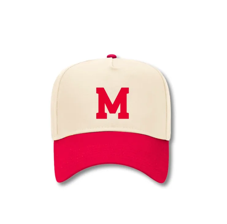 Cream and red two‑tone baseball cap with a bold red letter M on the front.