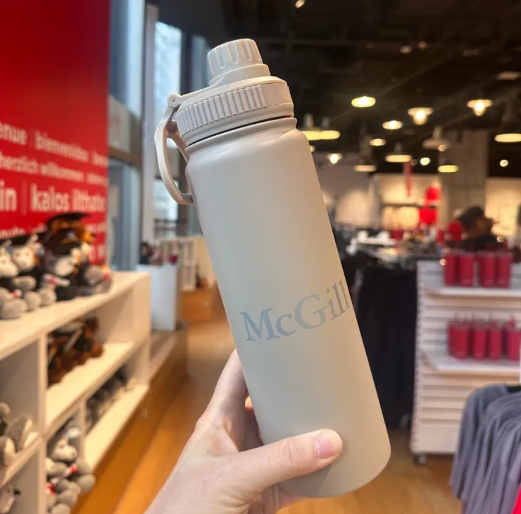 Sand-coloured McGill stainless steel water bottle with twist‑top lid and light grey McGill logo