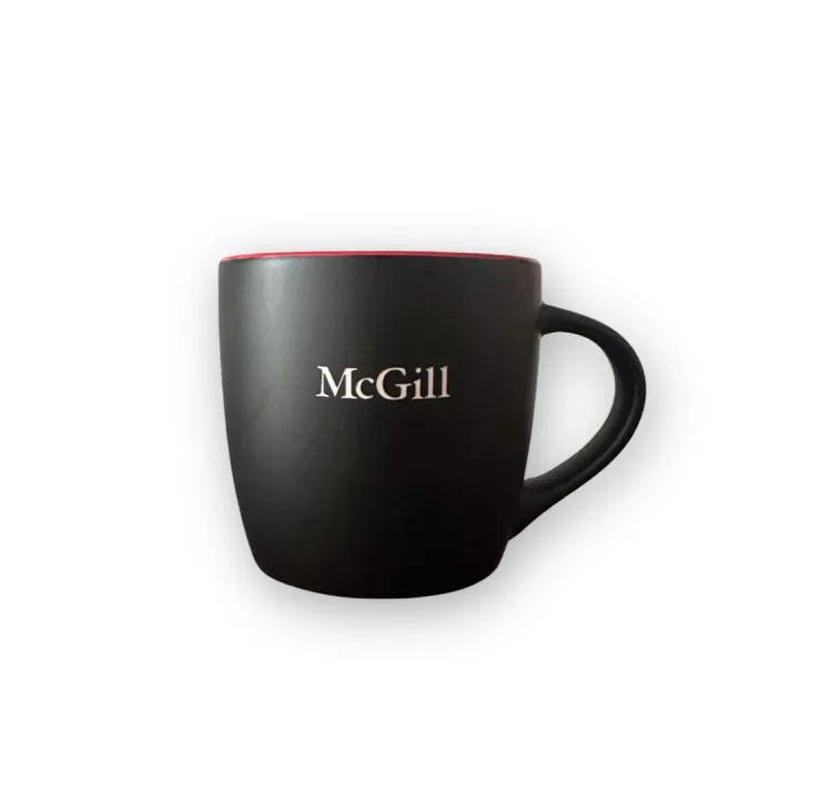 Black McGill mug with matte exterior, glossy red interior, and engraved McGill wordmark