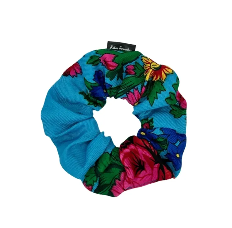 Light Blue floral scrunchie with vibrant pink flowers and green leaves, designed by Kokom Scrunchies.