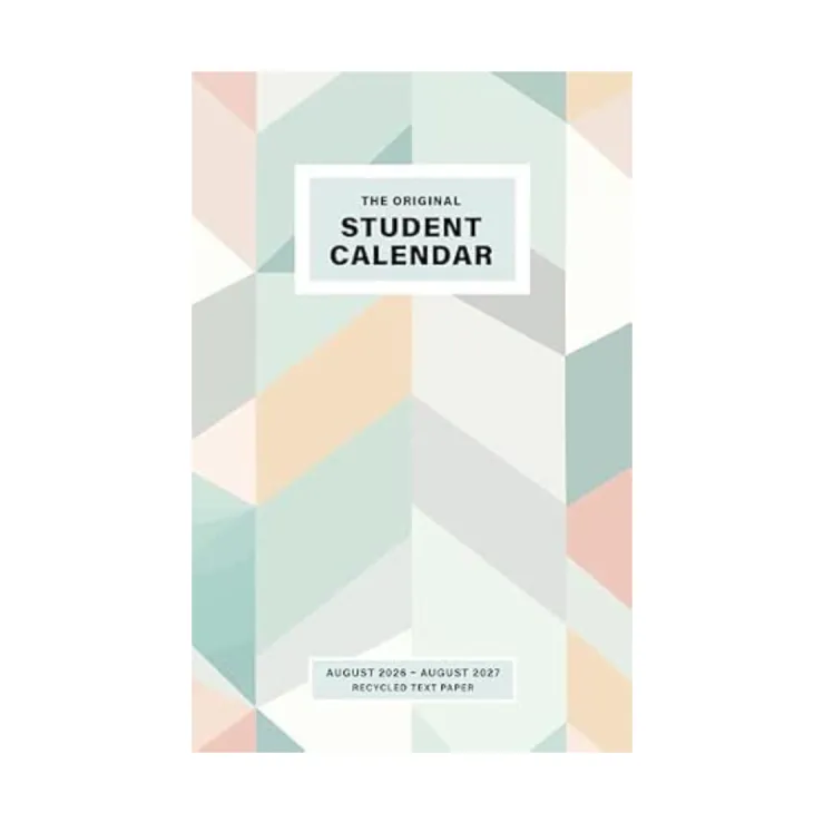 Spiral-bound student calendar with a geometric pastel cover design, set against a stone surface with blurred foliage in the background. The calendar is titled 'The Original Student Calendar' for McGill University, covering dates from August 2026 to August 2027
