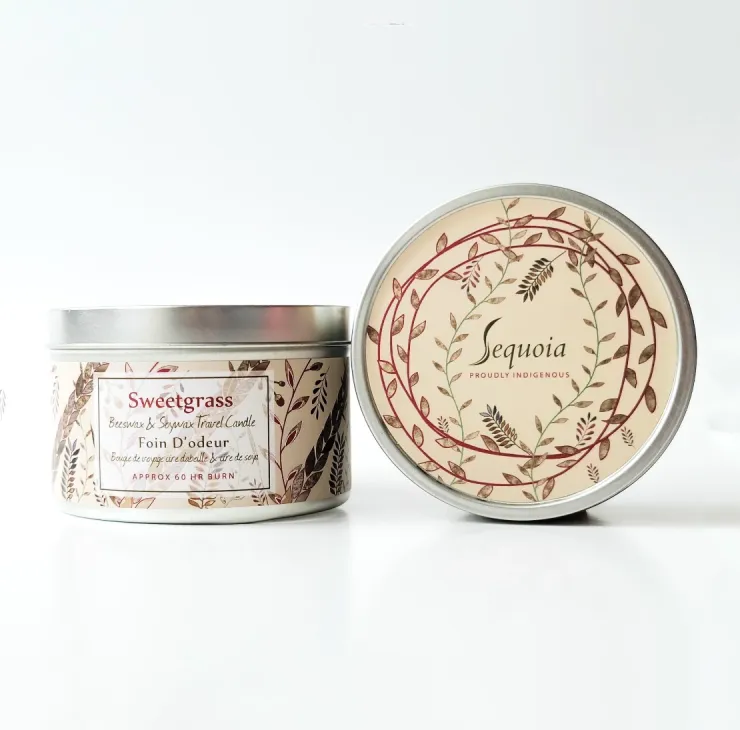 Sequoia Sweet Grass scented candle in decorative tin with botanical pattern and silver lid.