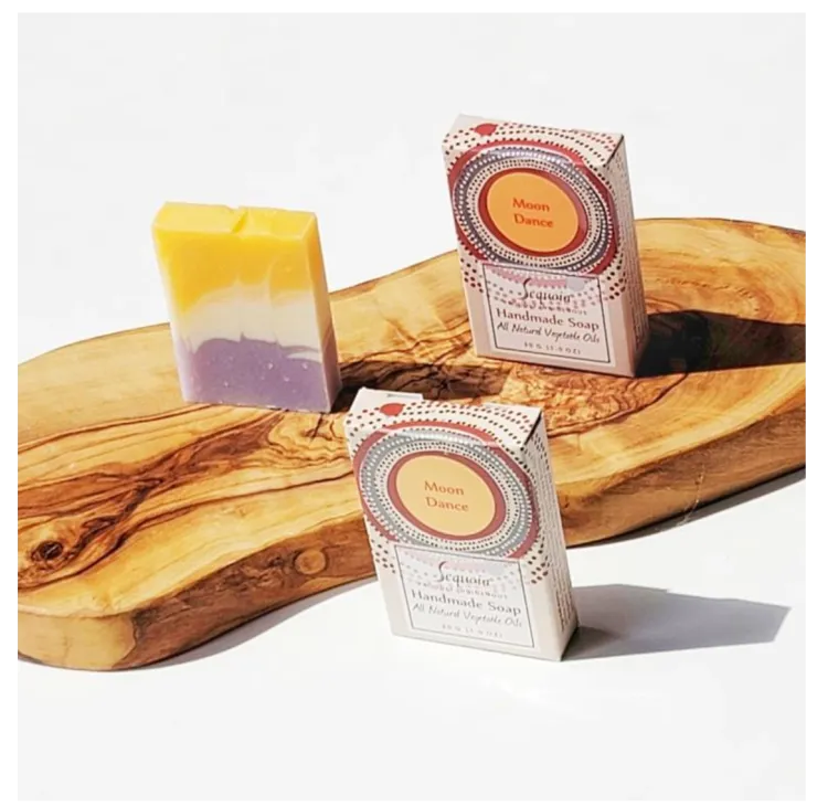 Sequoia Moon Dance handmade soap bar with natural oils, displayed beside decorative product packaging.