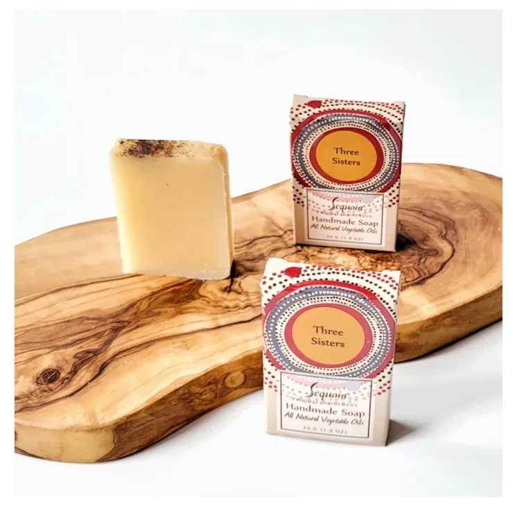 Sequoia Three Sisters handmade soap bar with natural oils, displayed beside decorative product packaging.