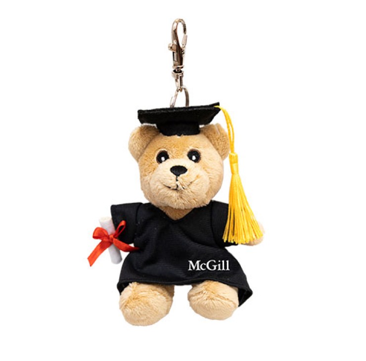 3" plush Grad Bear carrying a detachable diploma and dressed in a cap and gown featuring a golden tassel and “McGill” imprinted on the robe.