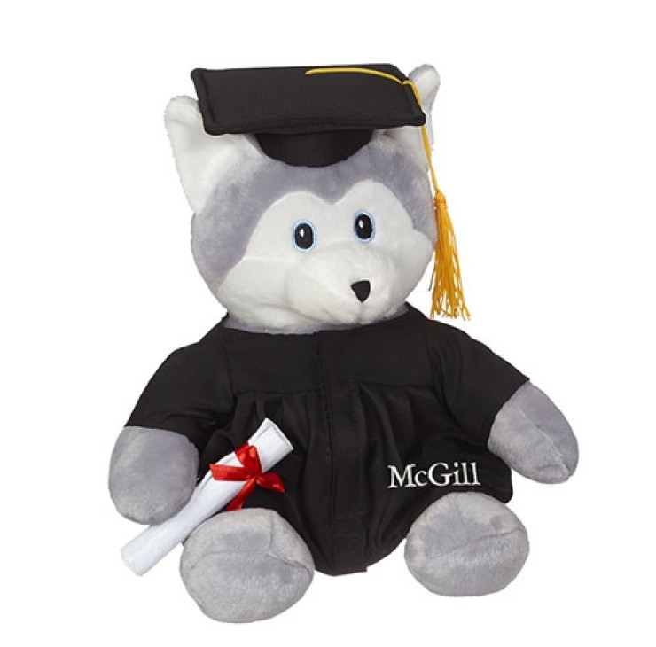 A 12" Husky Grad Plush carrying a diploma and wearing a grad cap and embroidered McGill gown.