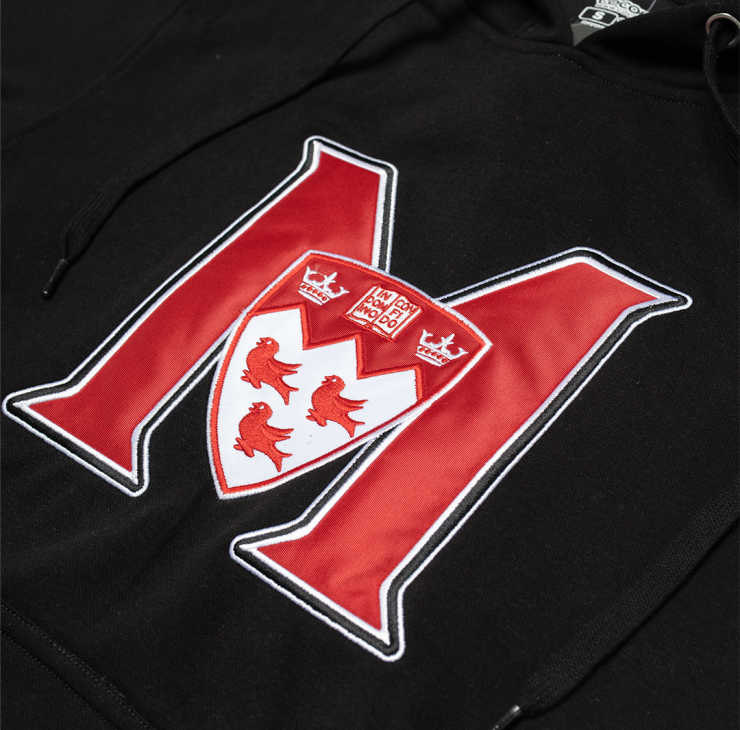 UNISEX – This classic fit pullover hoodie features a relaxed, comfortable silhouette that is neither too tight nor too loose. It offers ample room for layering without being baggy, making it ideal for everyday wear. The double fleece-lined hood is perfect for chilly weather. With ribbed cuffs and waistband, it features the McGill Athletics logo front and center so everyone knows which team you are cheering for.