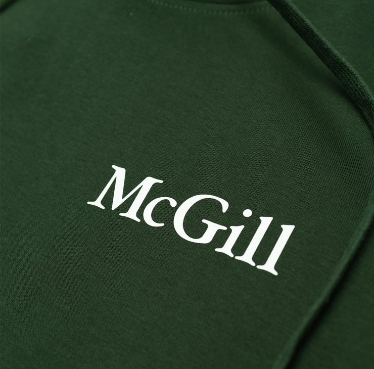 This classic fit pullover hoodie features a relaxed, comfortable silhouette that is neither too tight nor too loose. It offers ample room for layering without being baggy, making it ideal for everyday wear. The double fleece-lined hood is perfect for chilly weather. With ribbed cuffs and waistband, it features the McGill wordmark done in a white rubber print on the left chest