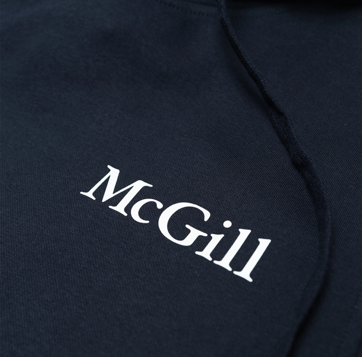 This classic fit pullover hoodie features a relaxed, comfortable silhouette that is neither too tight nor too loose. It offers ample room for layering without being baggy, making it ideal for everyday wear. The double fleece-lined hood is perfect for chilly weather. With ribbed cuffs and waistband, it features the McGill wordmark done in a white rubber print on the left chest