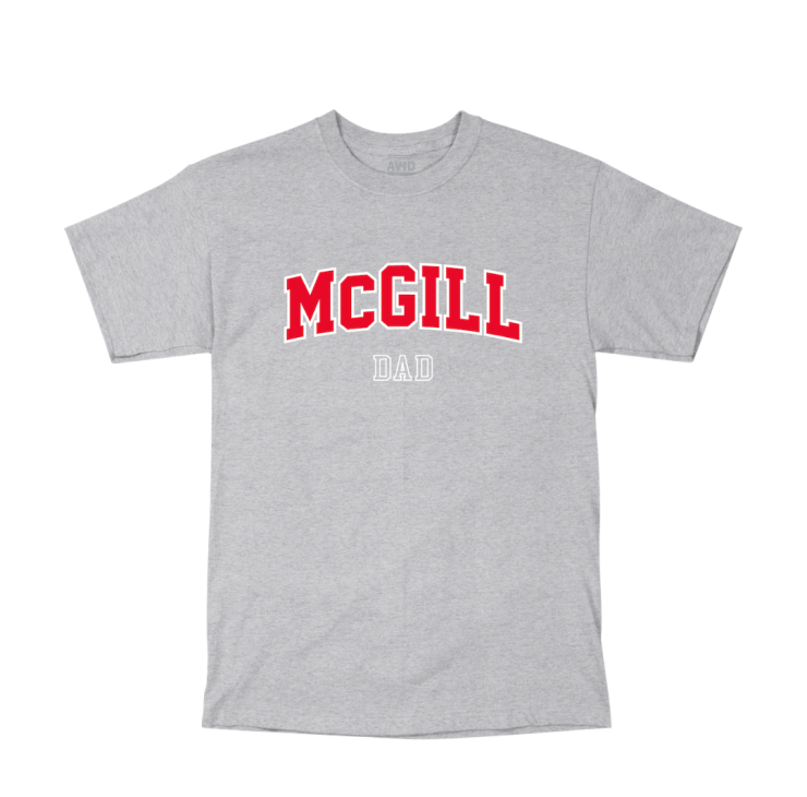 A grey short-sleeve T-shirt with "MCGILL DAD" printed on the front. "MCGILL" is in large, bold, red capital letters with a slight arch, and "DAD" is in smaller white letters below. 