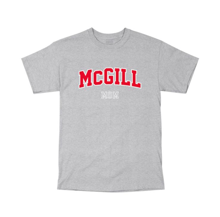 A grey short-sleeve T-shirt with "MCGILL MOM" printed on the front. "MCGILL" is in large, bold, red capital letters with a slight arch, and "MOM" is in smaller white letters below. 