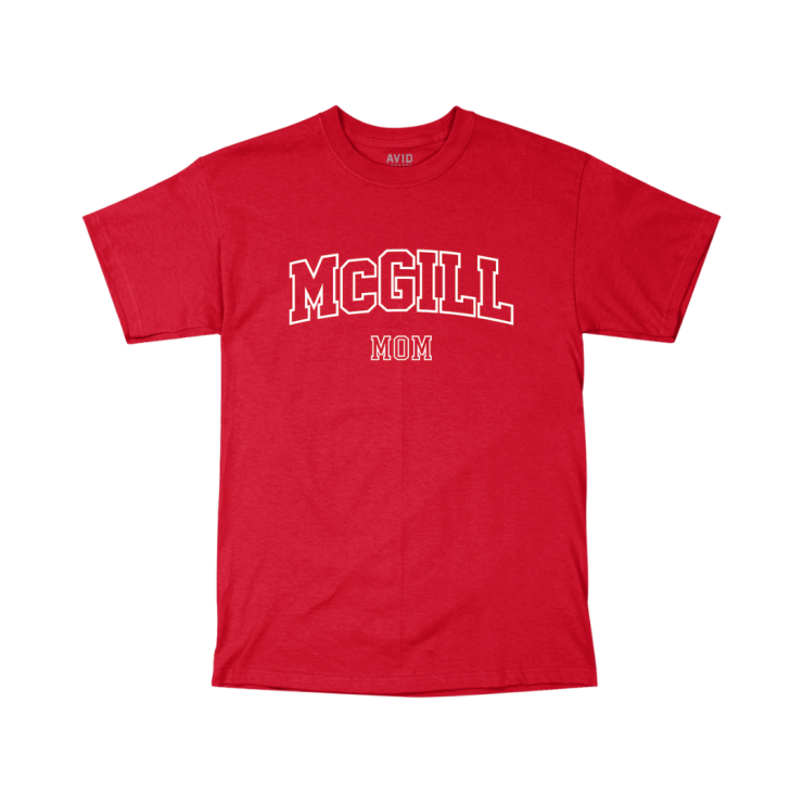 A red short-sleeve T-shirt with "MCGILL MOM" printed on the front. "MCGILL" is in large, bold, white capital letters with a slight arch, and "MOM" is in smaller white letters below. 