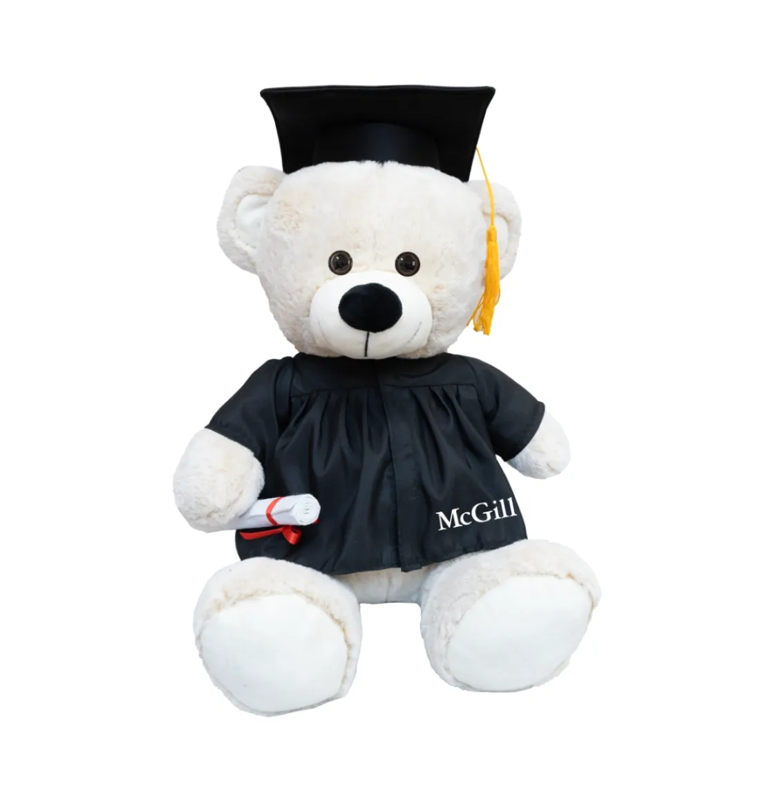 Plush McGill graduation teddy bear wearing black cap and gown and holding a diploma, with McGill logo on robe.