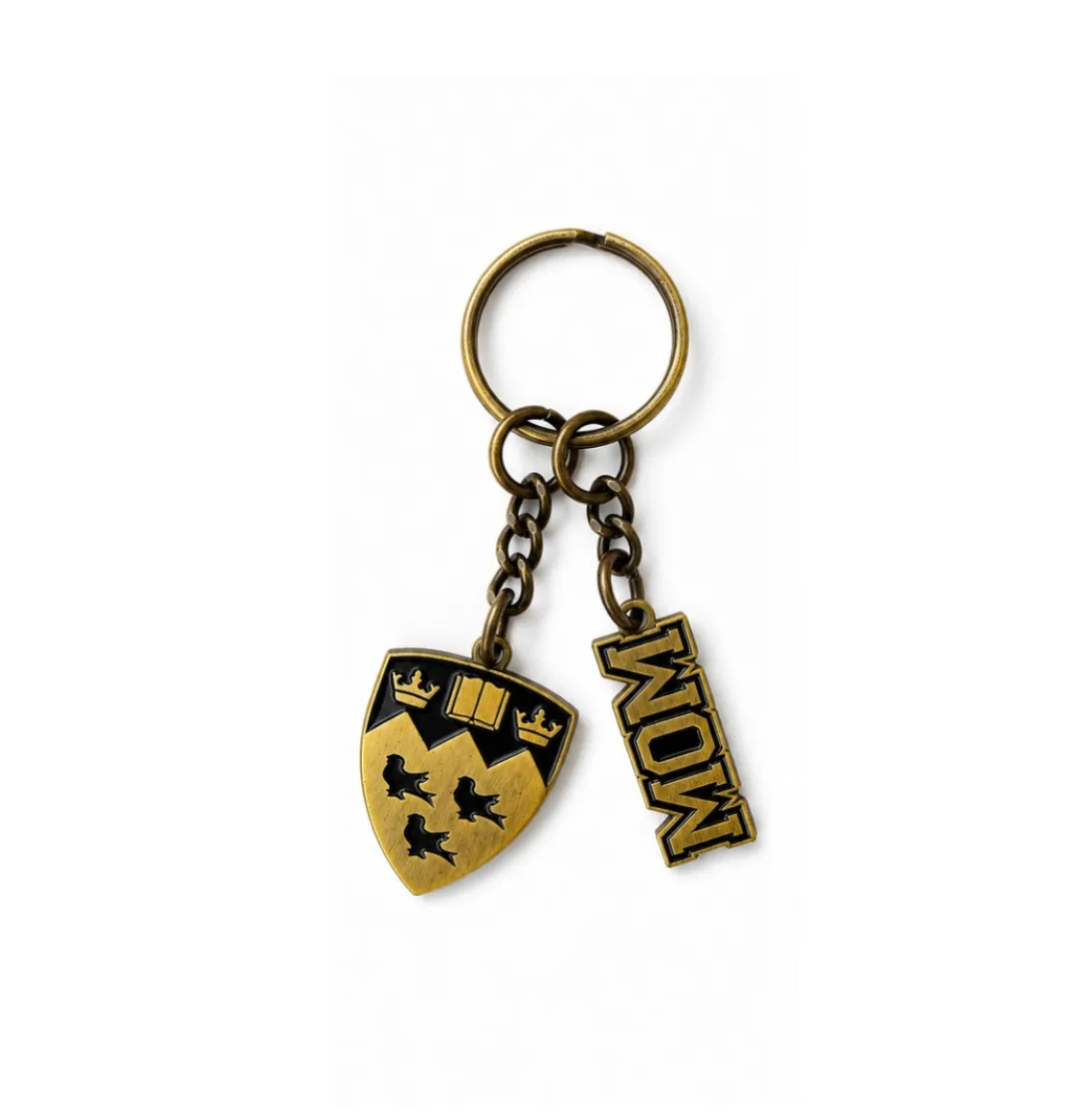 Antique gold tone McGill Mom keychain with embossed crest and “Mom” lettering on chain hardware