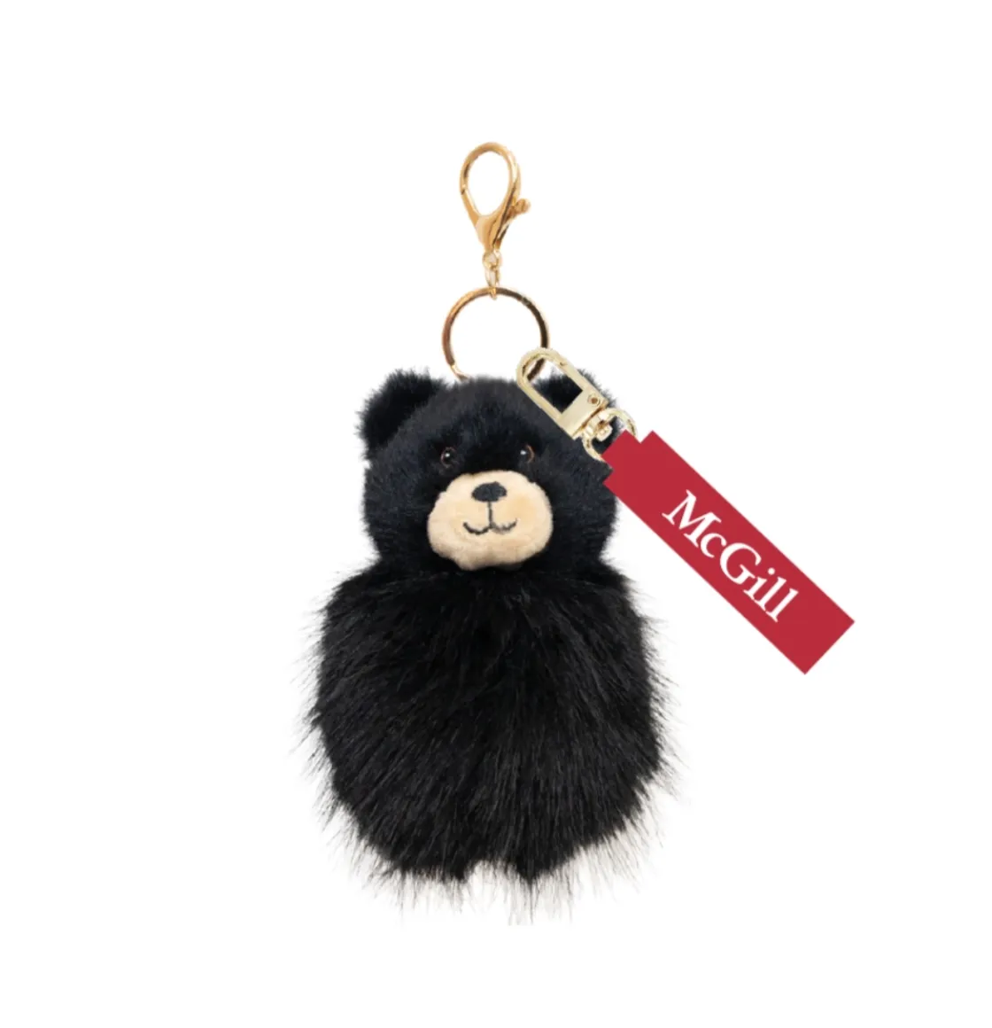 Black plush bear keychain with gold clip and ring, featuring red McGill tag and soft faux fur body.
