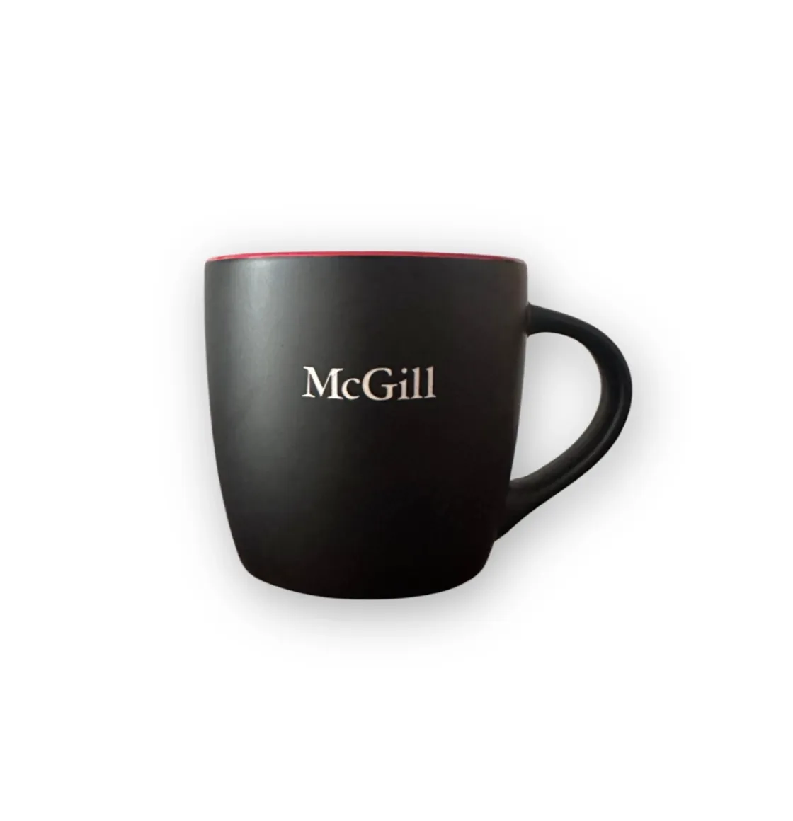 Black McGill mug with matte exterior, glossy red interior, and engraved McGill wordmark