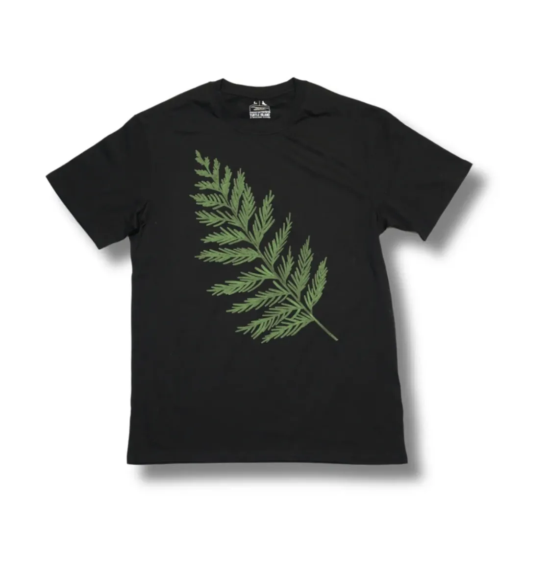 Black T-shirt with green cedar branch graphic.