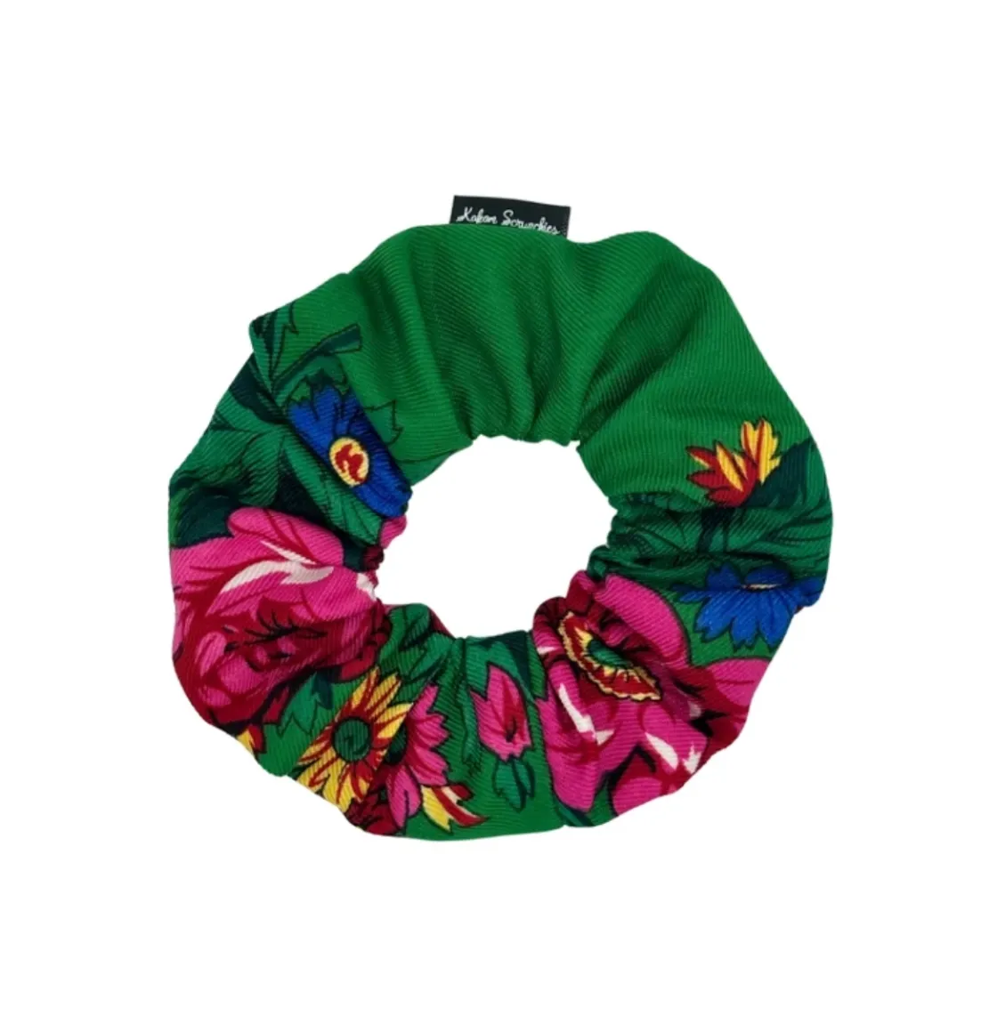 Green floral scrunchie with vibrant pink flowers and green leaves, designed by Kokom Scrunchies.