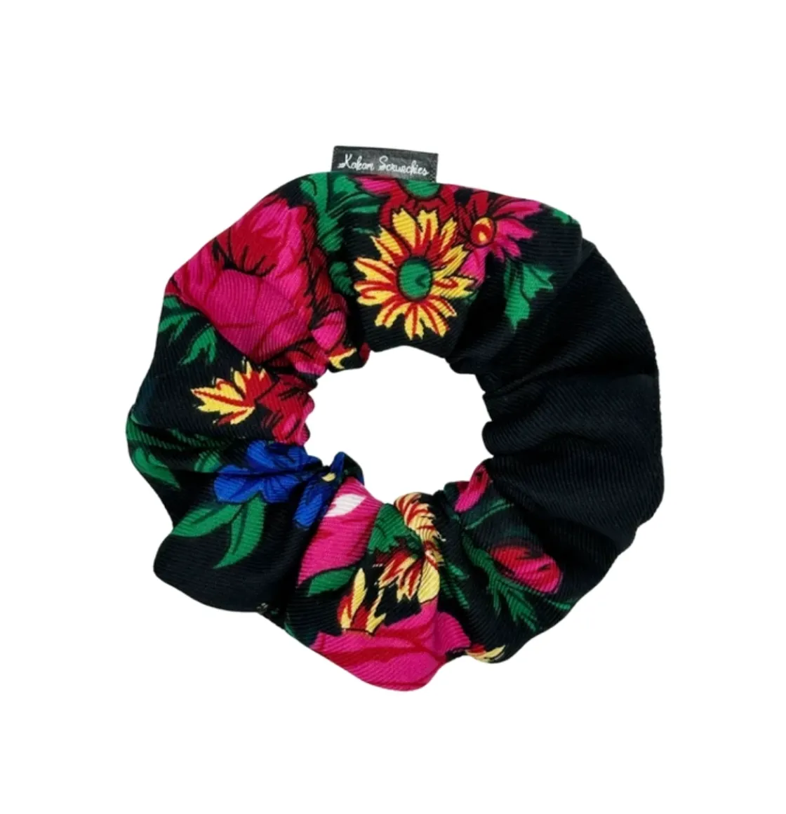 Black  floral scrunchie with vibrant pink and blue flowers and green leaves, designed by Kokom Scrunchies.