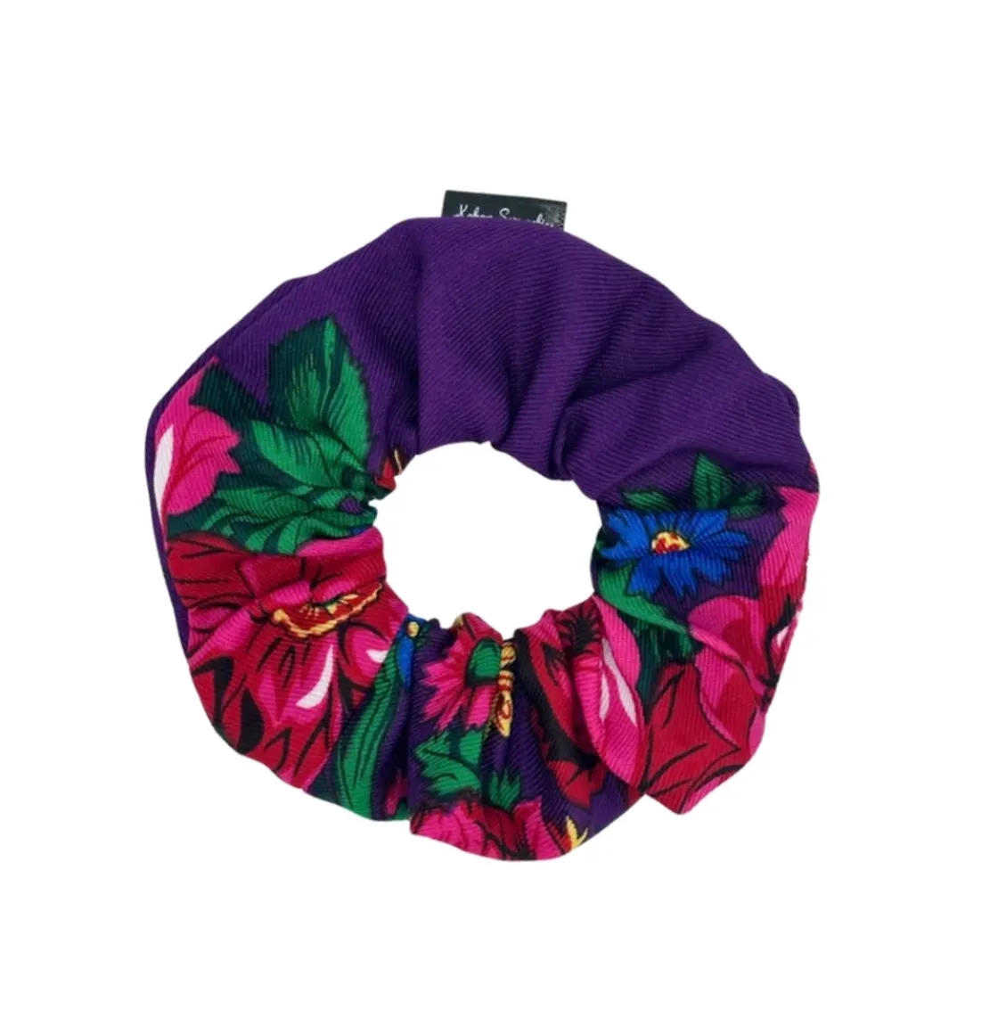 Purple floral scrunchie with vibrant pink and red flowers with green leaves, designed by Kokom Scrunchies.