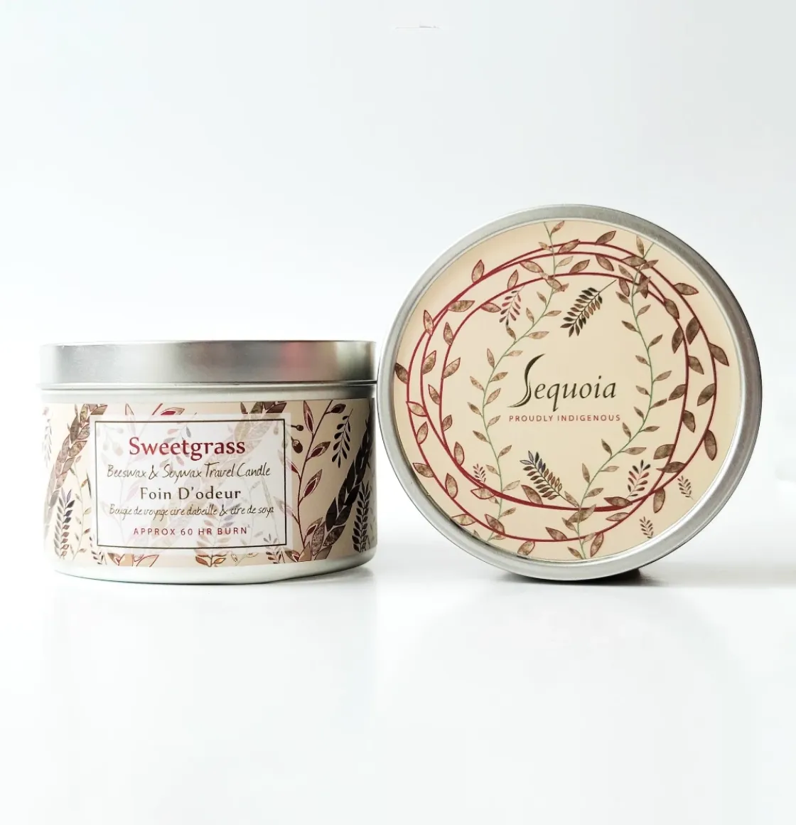 Sequoia Sweet Grass scented candle in decorative tin with botanical pattern and silver lid.