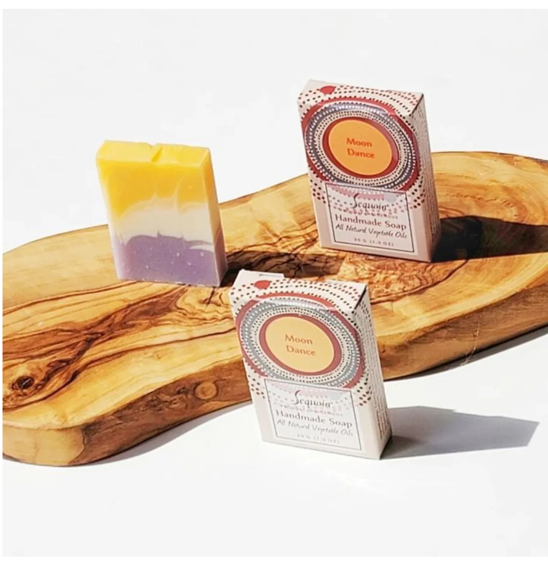 Sequoia Moon Dance handmade soap bar with natural oils, displayed beside decorative product packaging.